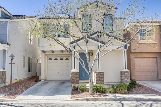 townhome / multi-family property featuring a garage, concrete driveway, and stucco siding