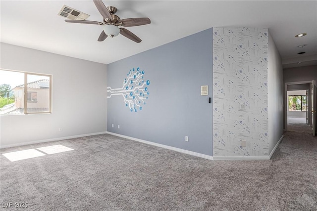 carpeted spare room featuring a ceiling fan, recessed lighting, visible vents, and baseboards