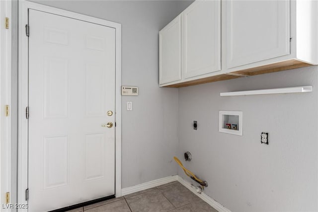 laundry area featuring light tile patterned floors, hookup for an electric dryer, washer hookup, baseboards, and cabinet space