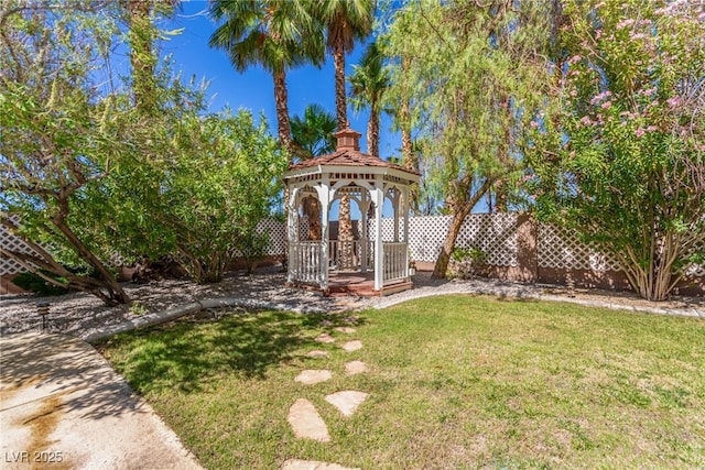 view of yard with a gazebo and fence