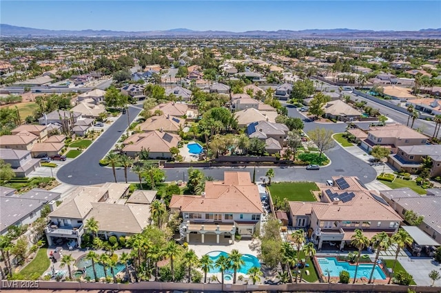 drone / aerial view with a residential view and a mountain view