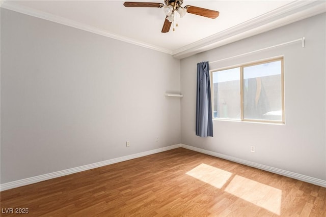 unfurnished room with crown molding, light wood-style flooring, baseboards, and ceiling fan