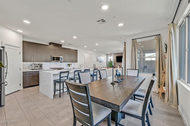 dining room with recessed lighting, visible vents, and light tile patterned floors