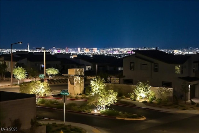 exterior space featuring a view of city lights