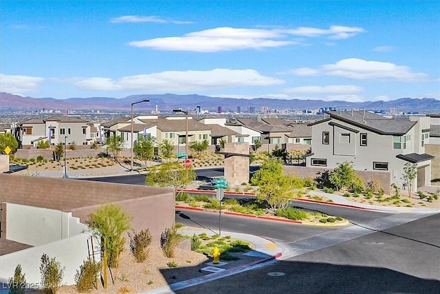 view of community with a mountain view and a residential view