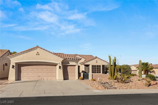 mediterranean / spanish house with an attached garage, cooling unit, a tiled roof, concrete driveway, and stucco siding