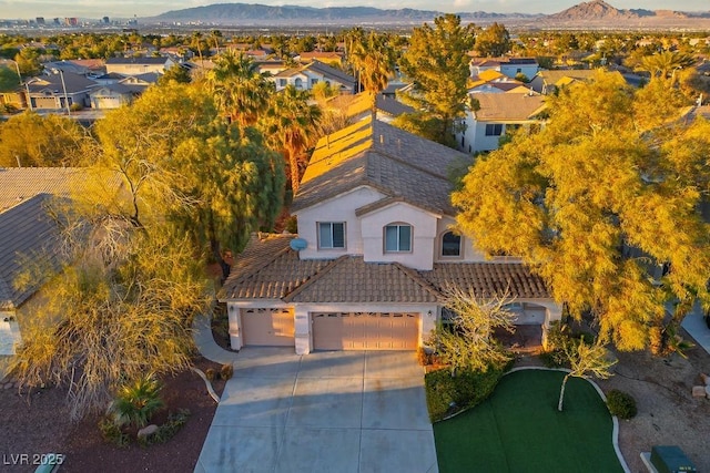 drone / aerial view with a residential view and a mountain view