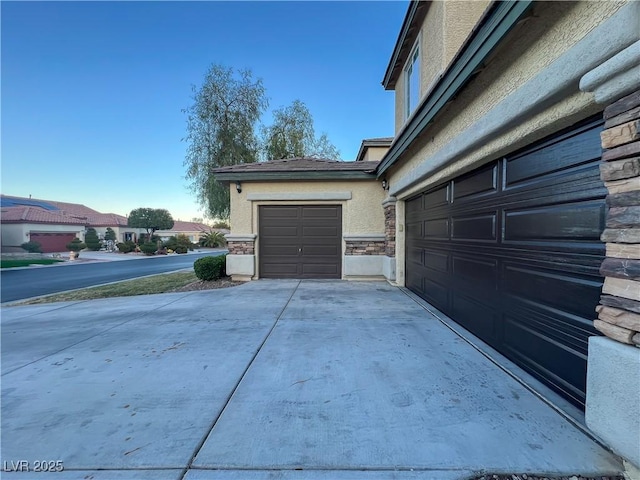 garage featuring driveway