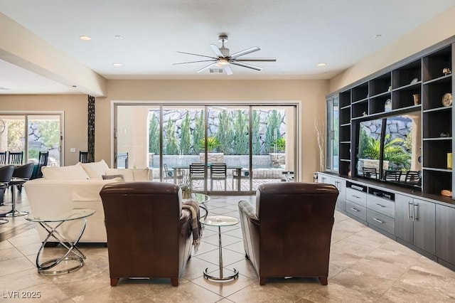 living area featuring light tile patterned floors, ceiling fan, and recessed lighting