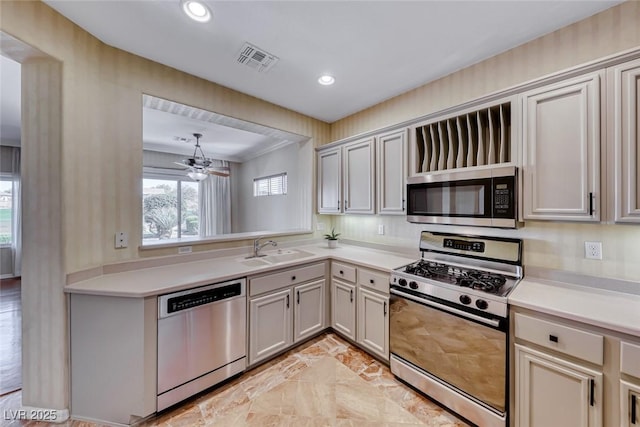 kitchen featuring recessed lighting, light countertops, visible vents, appliances with stainless steel finishes, and a sink