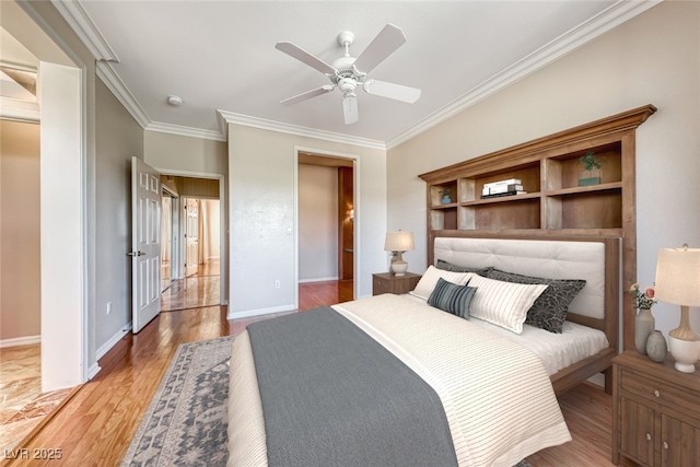 bedroom with crown molding, light wood-style flooring, baseboards, and ceiling fan