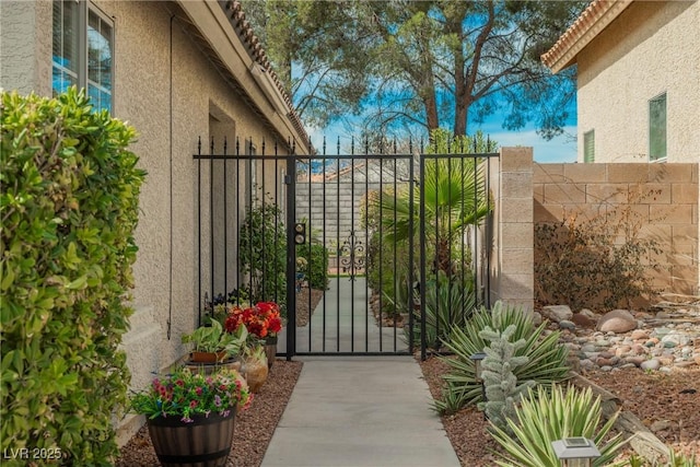 view of gate featuring fence