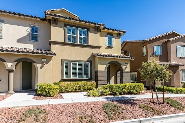 mediterranean / spanish-style home featuring stucco siding