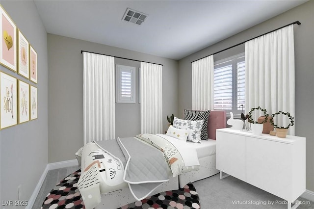 carpeted bedroom featuring visible vents, baseboards, and multiple windows