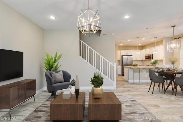 living area featuring baseboards, stairs, light wood-style floors, a notable chandelier, and recessed lighting