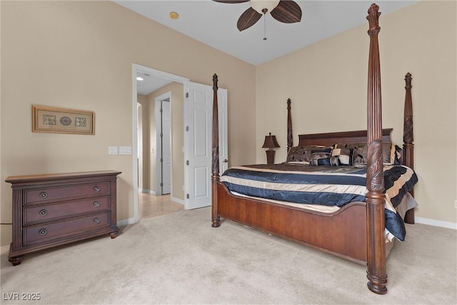 bedroom featuring baseboards, light colored carpet, and a ceiling fan