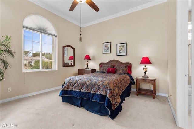 carpeted bedroom with a ceiling fan, baseboards, and ornamental molding