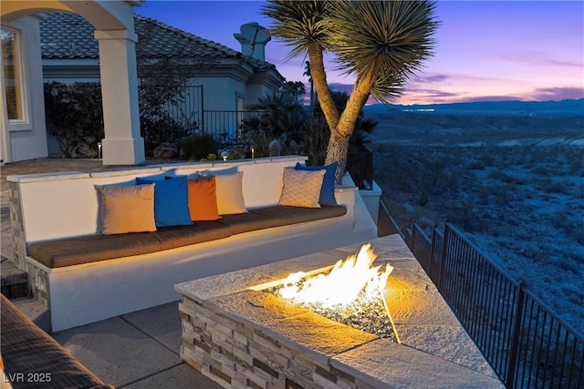 exterior space featuring an outdoor fire pit