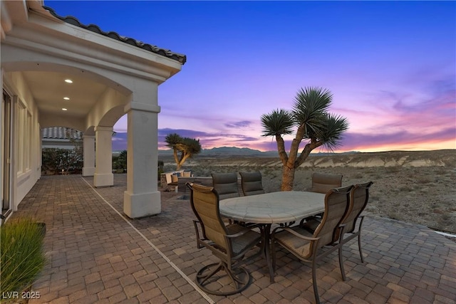 patio terrace at dusk with outdoor dining space