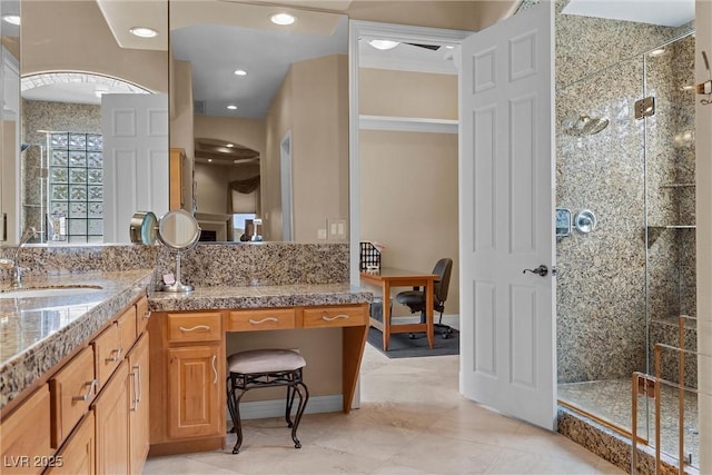 bathroom featuring recessed lighting, vanity, and a shower stall