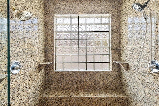 bathroom with a tile shower