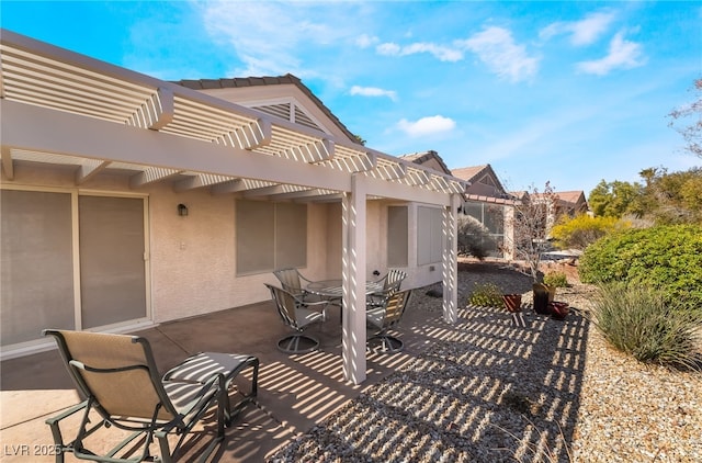 view of patio / terrace with outdoor dining space and a pergola