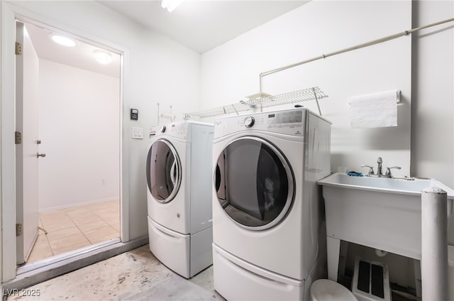 washroom featuring laundry area and washer and dryer