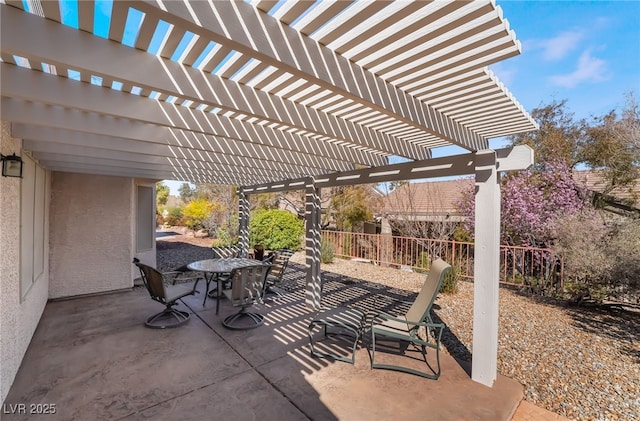 view of patio / terrace featuring outdoor dining area and fence