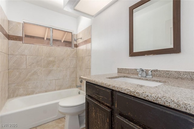 bathroom featuring tile patterned flooring, vanity, toilet, and shower / bathtub combination