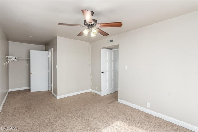 unfurnished bedroom with carpet, baseboards, visible vents, and a closet