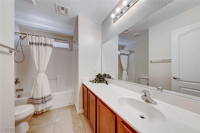 bathroom with tile patterned flooring, visible vents, vanity, and toilet