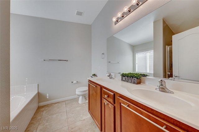 bathroom with double vanity, a sink, visible vents, and tile patterned floors