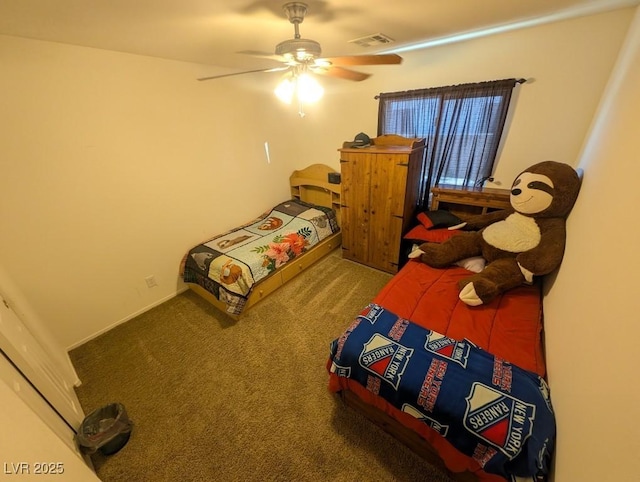 bedroom featuring a ceiling fan, visible vents, and carpet flooring