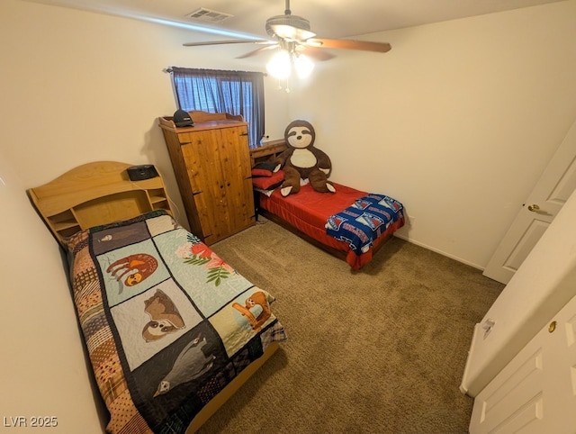 bedroom with carpet, visible vents, and ceiling fan