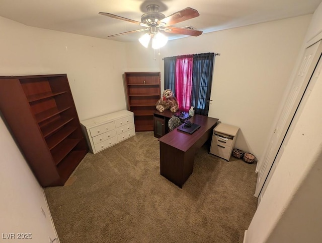 carpeted office space with ceiling fan