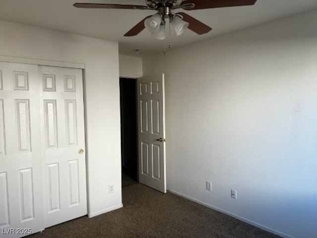 unfurnished bedroom with carpet floors, a closet, ceiling fan, and baseboards