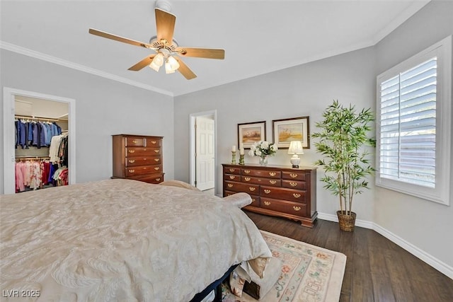 bedroom with dark wood-style floors, a closet, ornamental molding, and baseboards