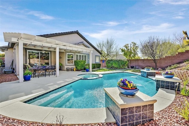 view of swimming pool with a patio area, a pool with connected hot tub, fence, and a pergola