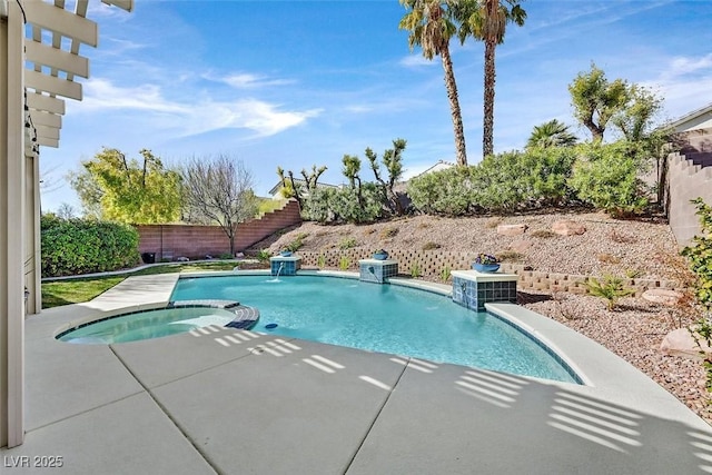 view of swimming pool with a fenced backyard and a pool with connected hot tub