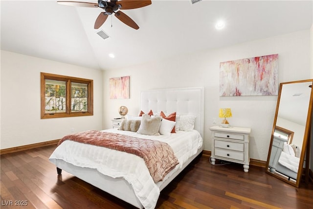 bedroom featuring lofted ceiling, wood finished floors, visible vents, and baseboards