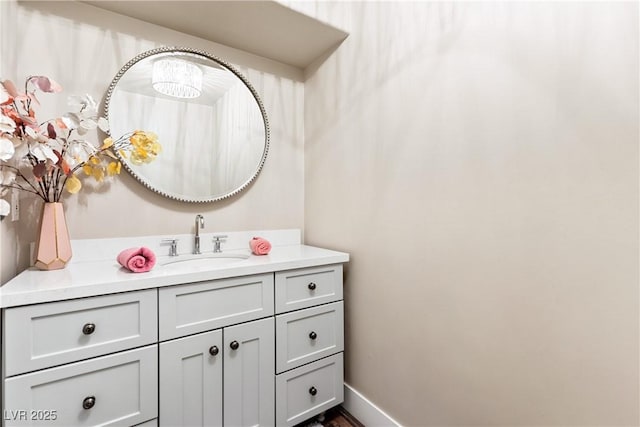 bathroom with vanity and baseboards