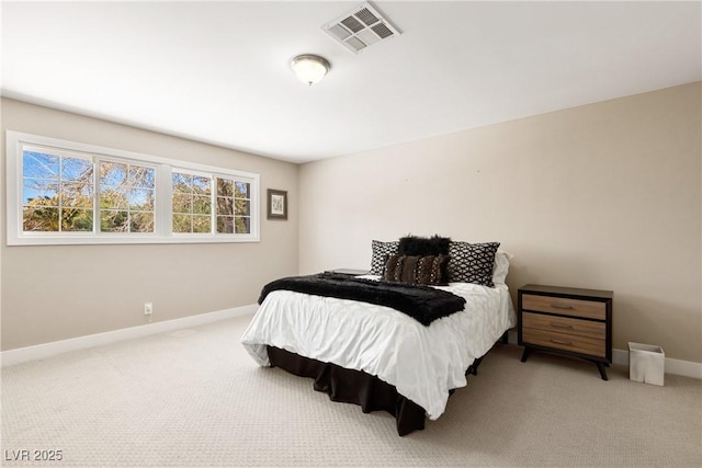 carpeted bedroom with baseboards and visible vents