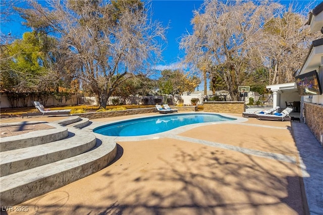 view of pool featuring a fenced in pool, a patio area, and a fenced backyard