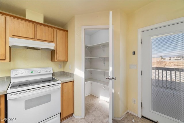 kitchen with light countertops, under cabinet range hood, baseboards, and white electric range oven