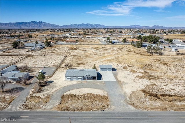 aerial view featuring view of desert and a mountain view