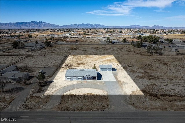 birds eye view of property featuring a mountain view