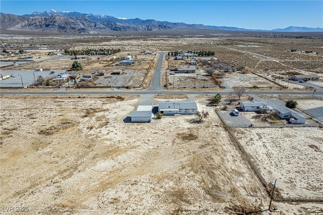 aerial view with view of desert and a mountain view