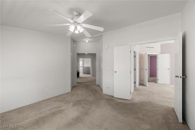 interior space with visible vents and a ceiling fan