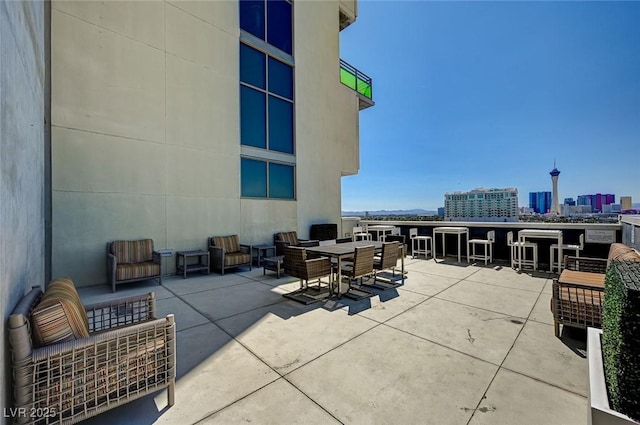 view of patio / terrace featuring a city view