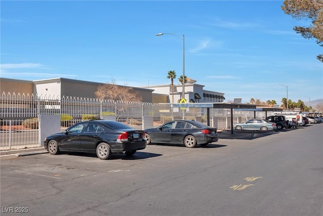 uncovered parking lot with fence